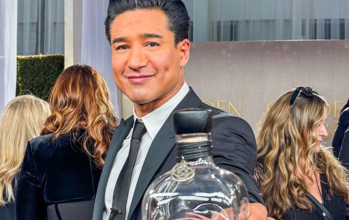 Mario Lopez at the Golden Globes holding a bottle of Casa Mexico Tequila