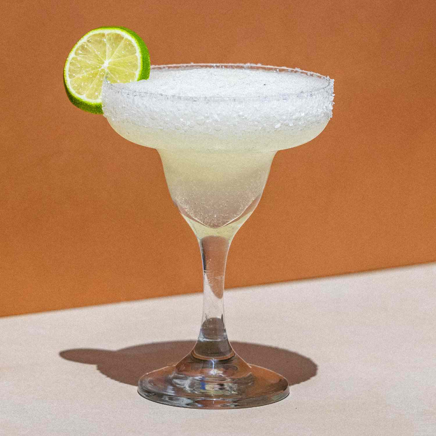Frozen margarita cocktail served chilled with garnish